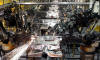 Robots weld underbodies for the Ford Mustang at the historic Dearborn Assembly Plant